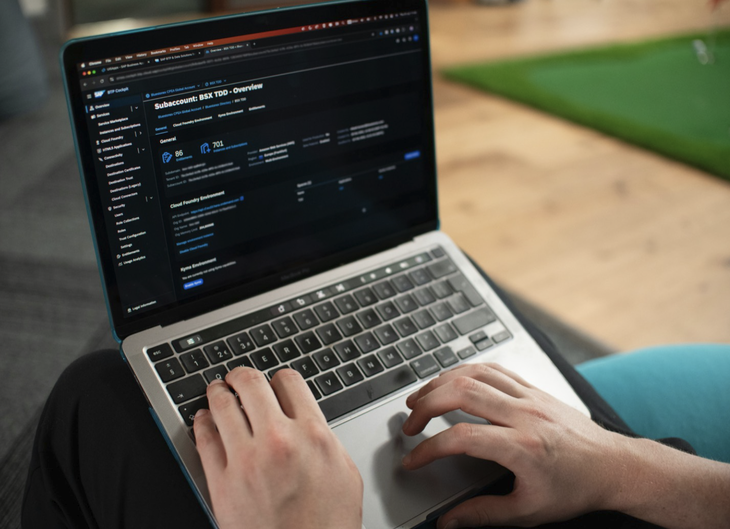 A person reviewing a software dashboard on a laptop